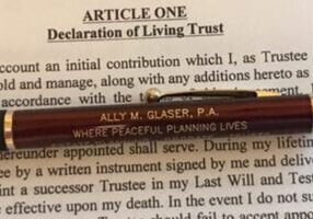 A pen and pencil on top of an article.